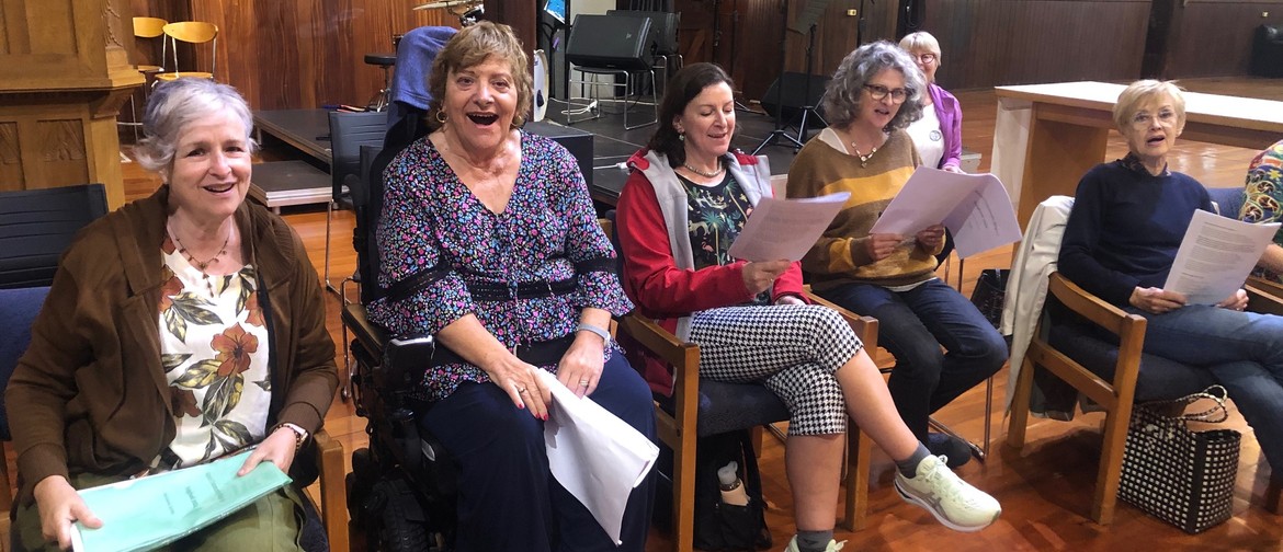 Members of Karori Community Singers sing together during a session