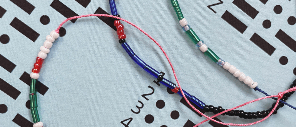 String with beads depicting Morse code on a Morse code decoder
