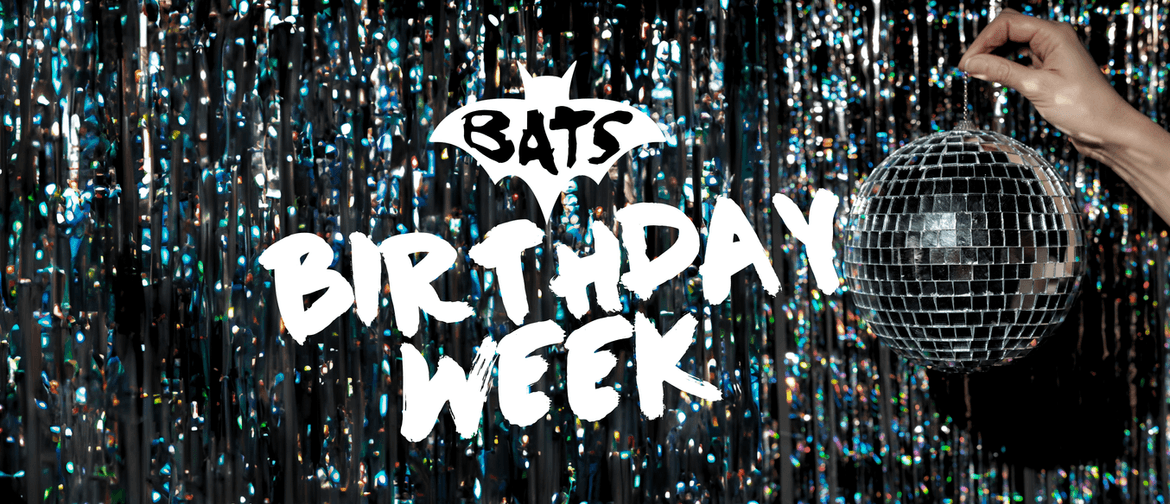 A disco ball being held up against a background of tinsel. It reads "BATS Birthday Week"