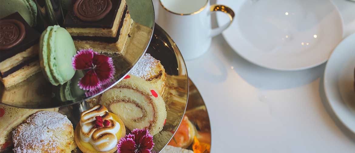 A high tea of sweet and savoury foods.