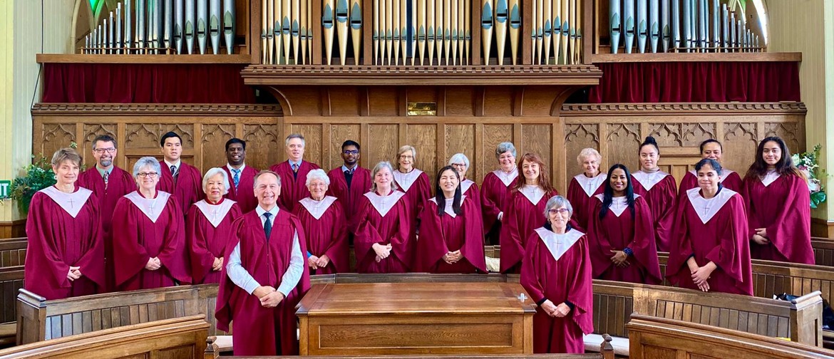 Mt Albert Methodist Choir wearing red robes in front of a pipe organ