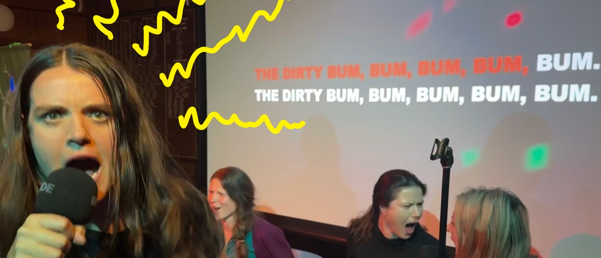 Miscast Musical Theatre Karaoke MC Maria Williams sings to camera, others in background are energetically singing, Karaoke text on screen behind singers reads: "The dirty bum, bum, bum, bum, bum, bum, bum.