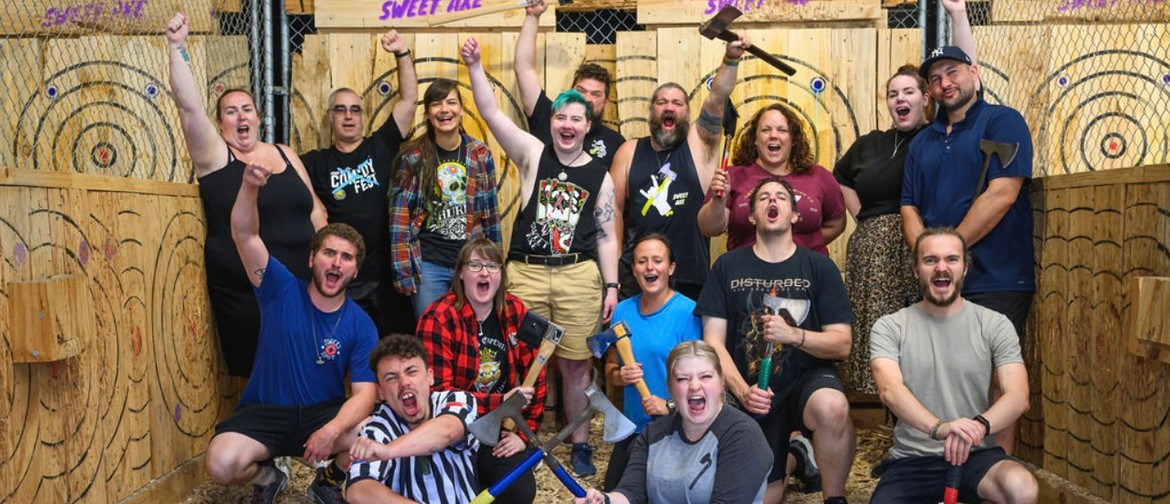 Axe Slinging Sundays Axe throwers shouting for a funny team photo.