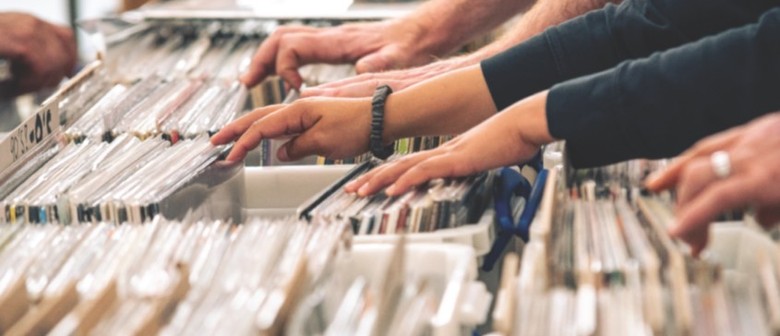 photo of people flicking through records