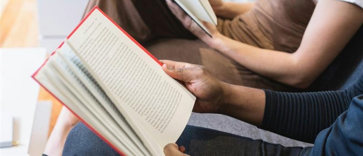 We Read Auckland Reading Party Two readers sitting reading books in a cosy spot
